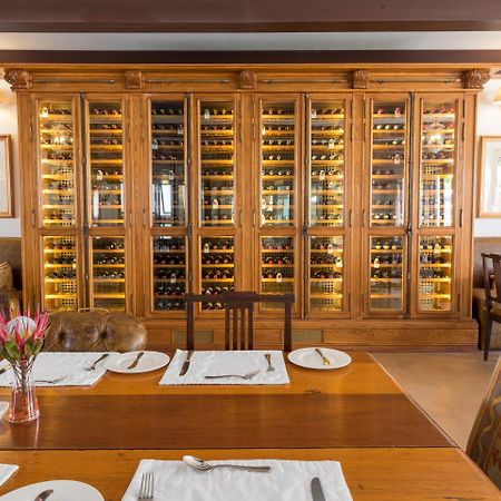 Drostdy Hotel Graaff Reinet Bagian luar foto Wine rack at the restaurant