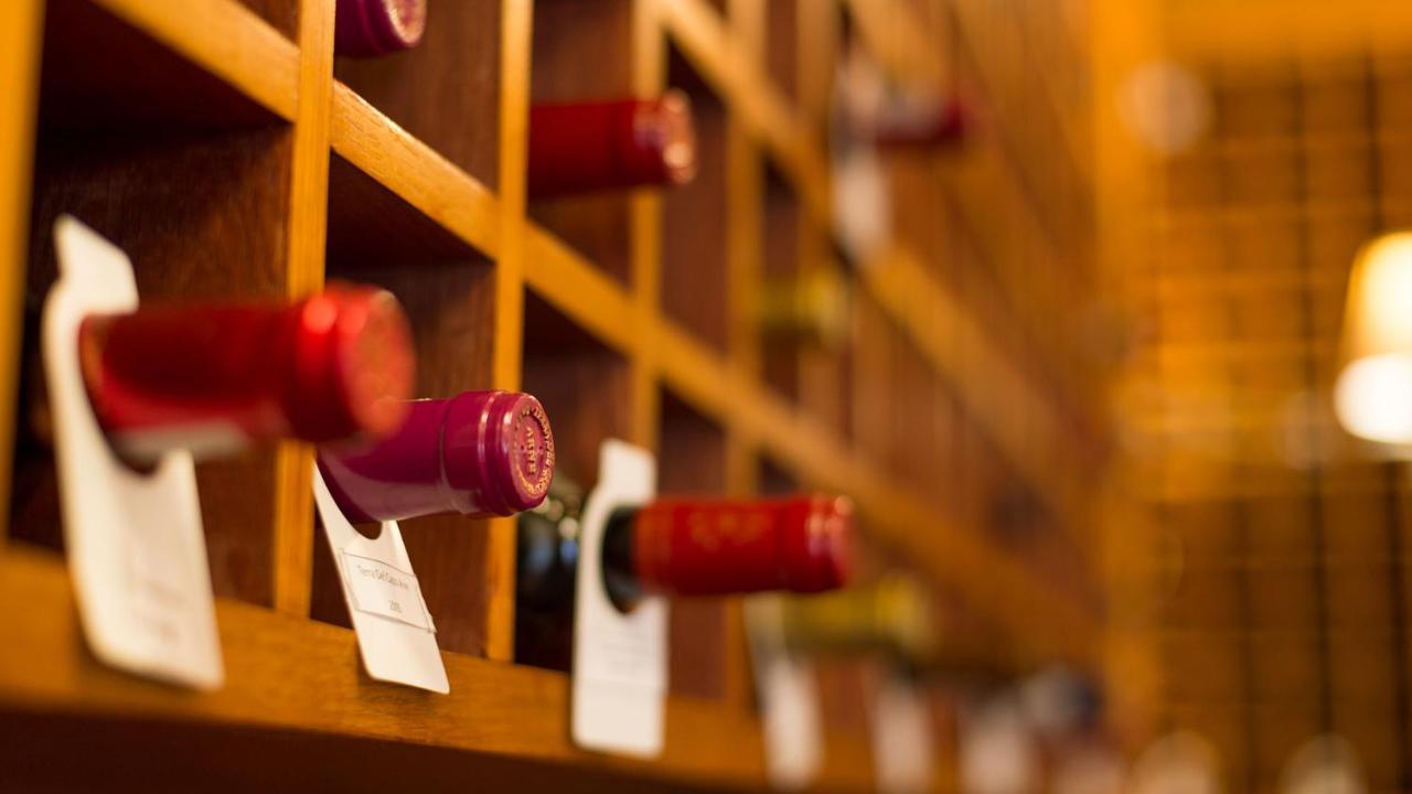 Drostdy Hotel Graaff Reinet Bagian luar foto Wine bottles in a wine rack