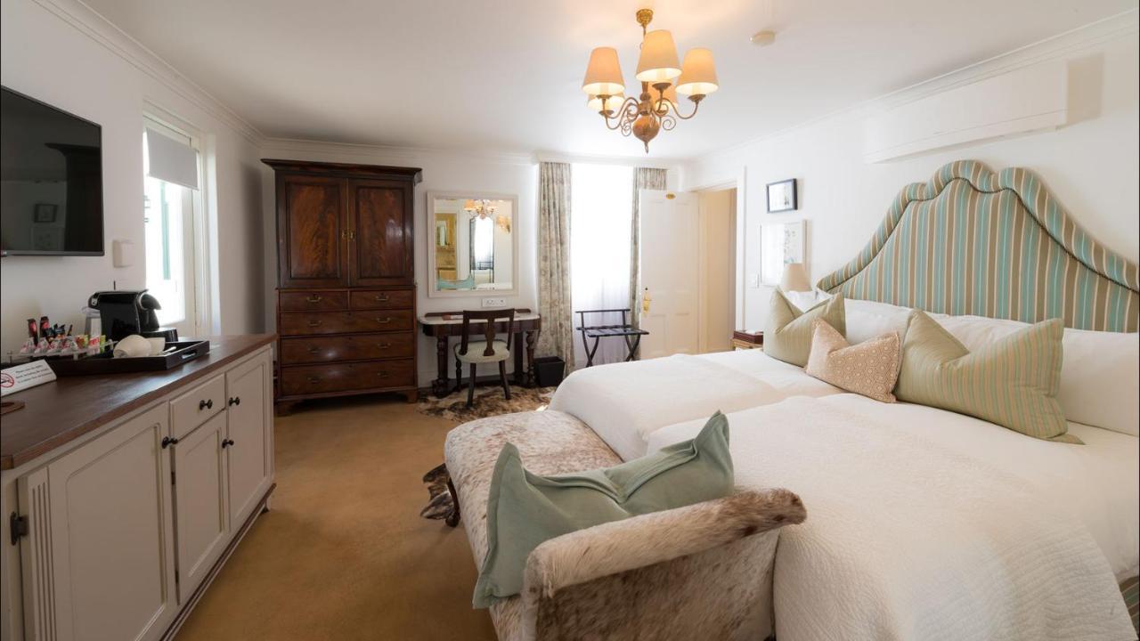 Drostdy Hotel Graaff Reinet Bagian luar foto A room at the hotel