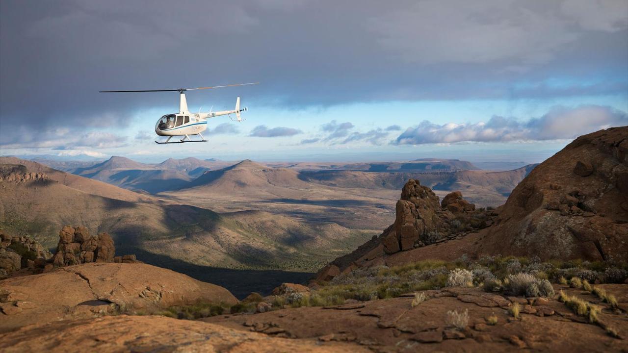 Drostdy Hotel Graaff Reinet Bagian luar foto A Robinson R44 helicopter flying over the Namib Desert