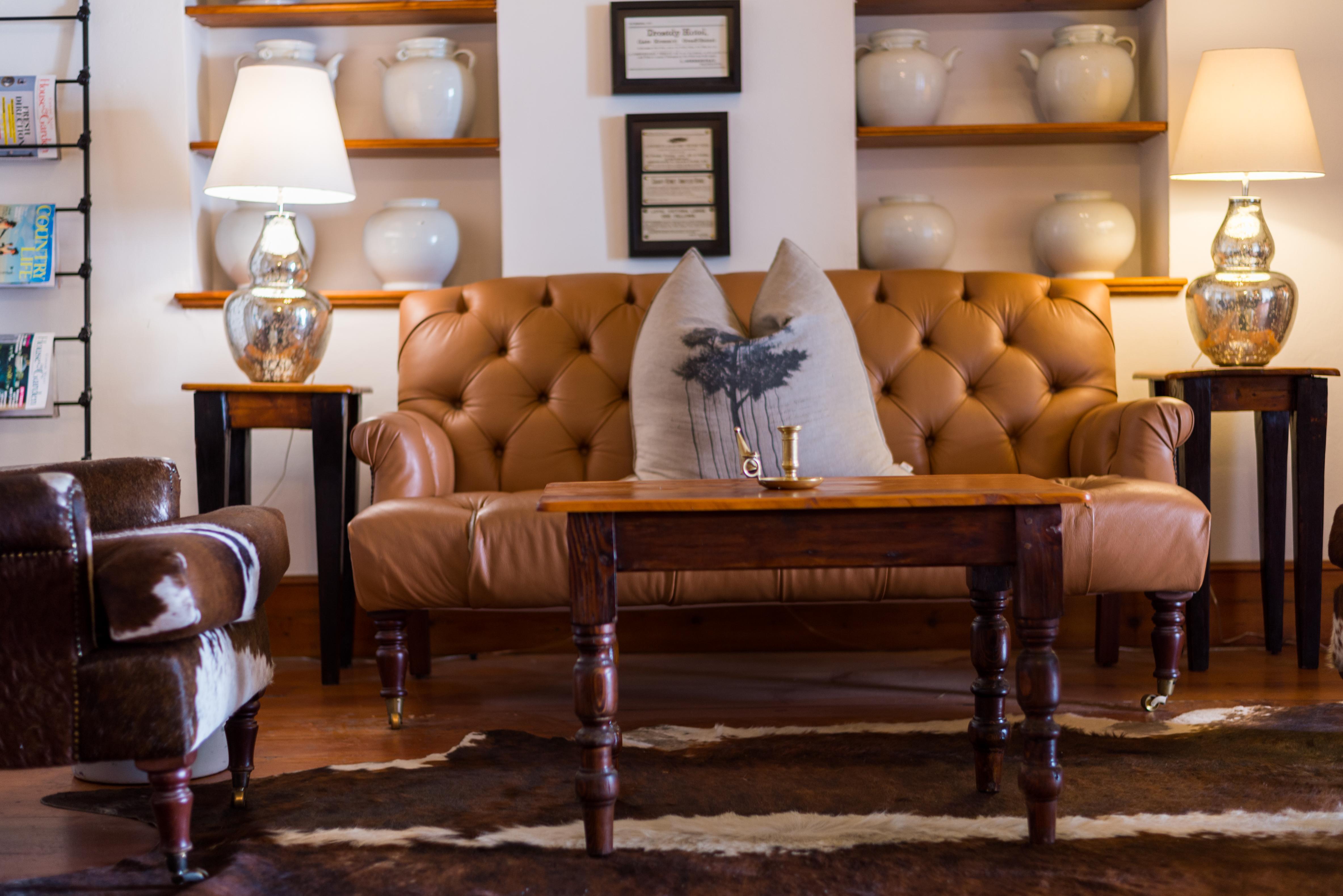 Drostdy Hotel Graaff Reinet Bagian luar foto A leather sofa