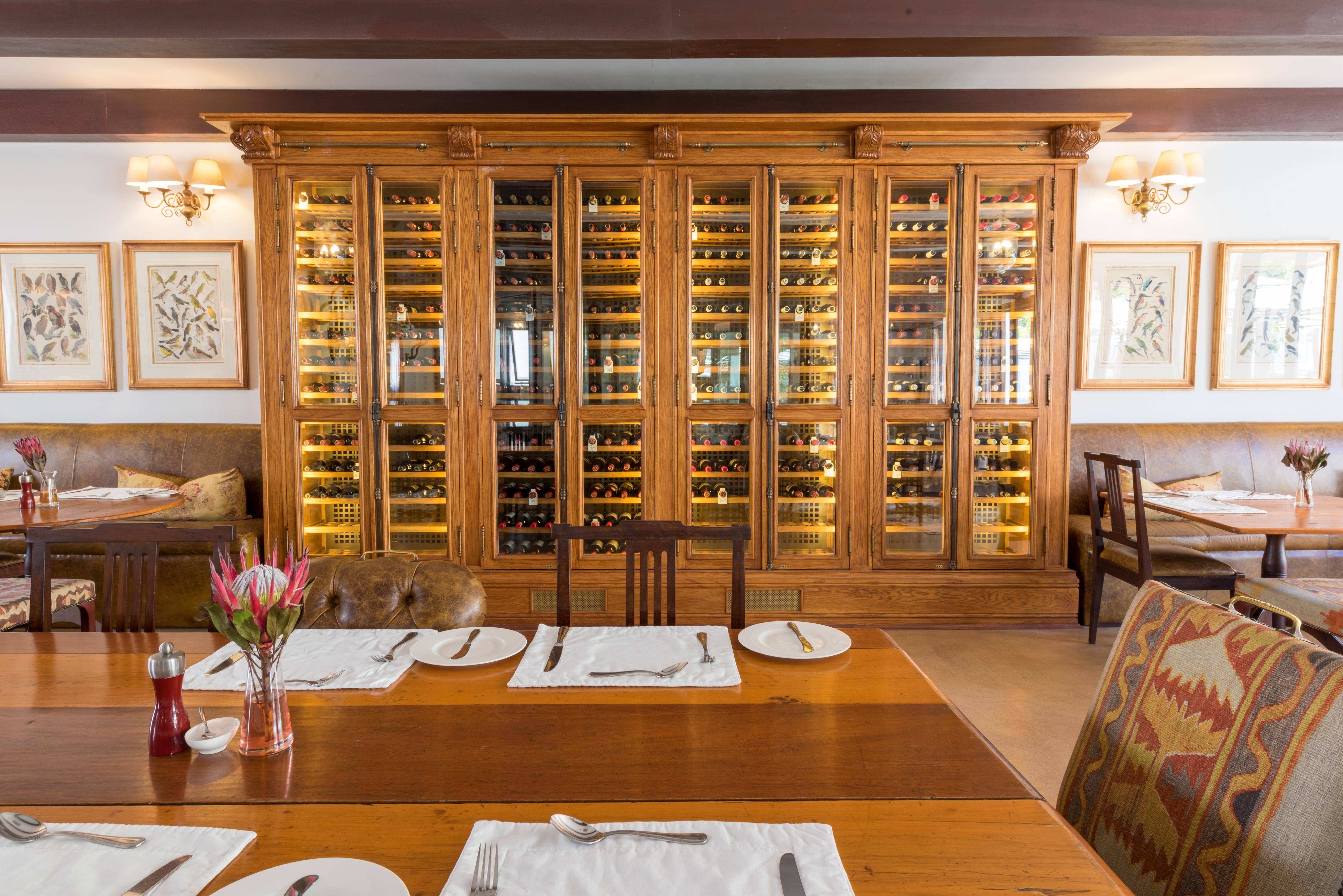 Drostdy Hotel Graaff Reinet Bagian luar foto Wine rack at the restaurant